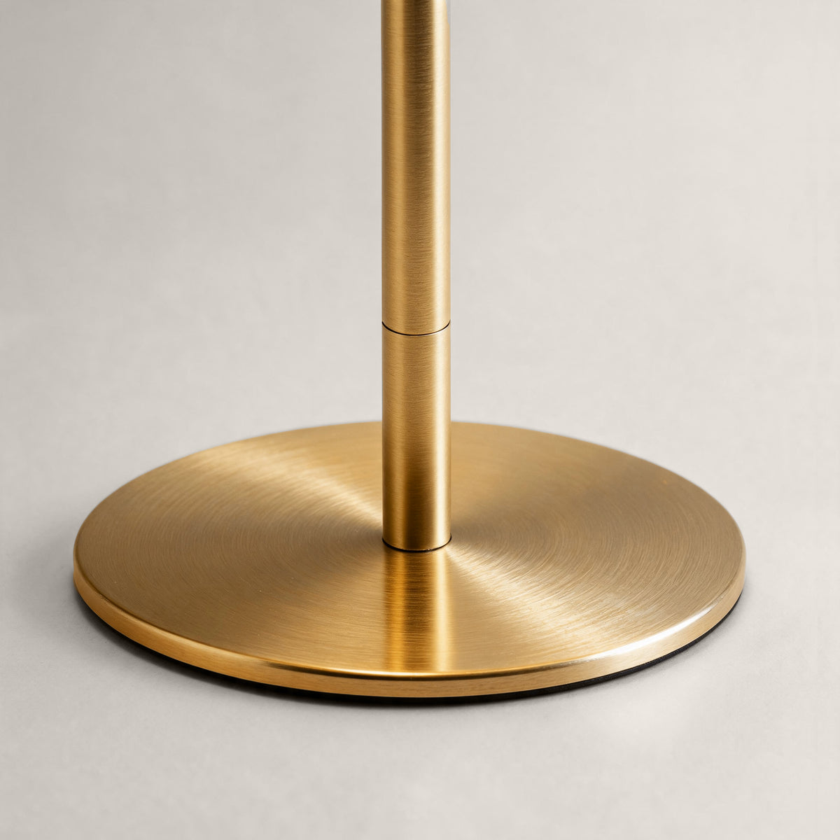 Brushed brass cordless mushroom table lamp base and adjustable stem detail