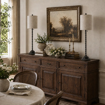 Two Lampworks black candlestick buffet lamps styling a rustic dining room sideboard