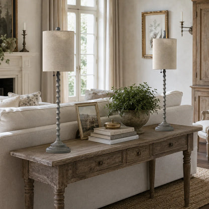 Lampworks weathered gray buffet lamps on a console table behind a living room sofa