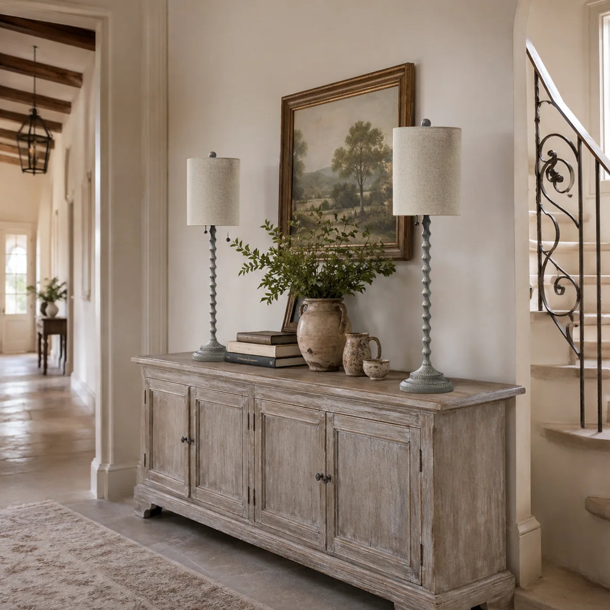 Two Lampworks farmhouse buffet lamps on a weathered wood hallway sideboard