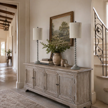 Two Lampworks farmhouse buffet lamps on a weathered wood hallway sideboard