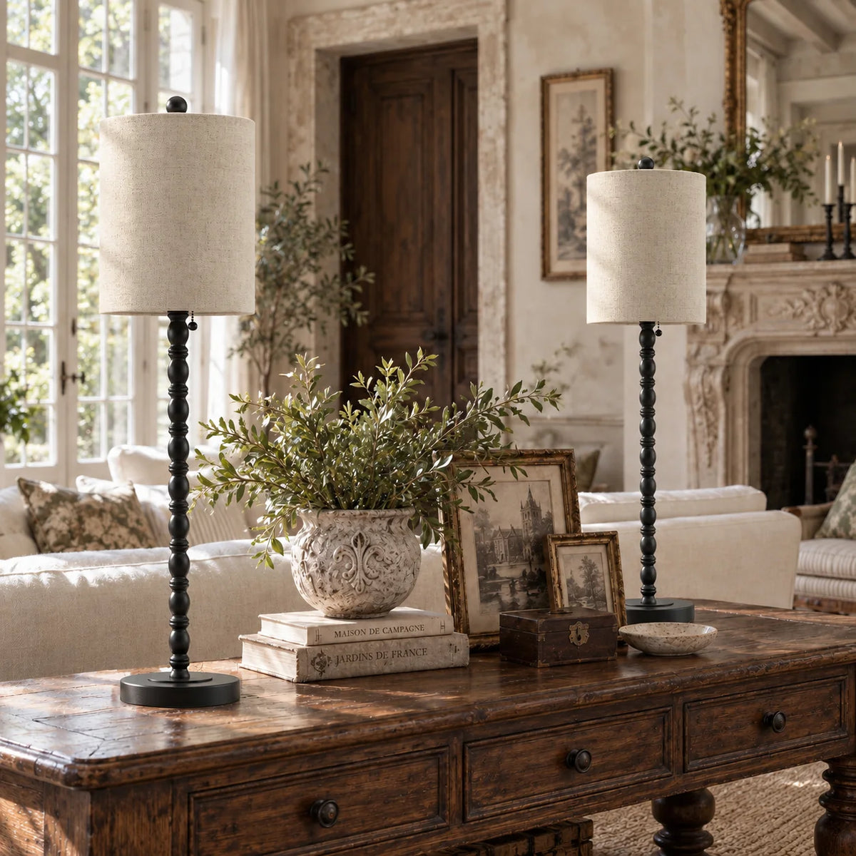 Lampworks matte black buffet lamps on a living room console table behind a sofa